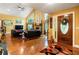 Open living area with hardwood floors, vaulted ceilings, and a cozy stone fireplace at 123 Cherry St, Roswell, GA 30075