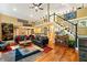Open living area with hardwood floors, high ceilings, and a modern aesthetic at 123 Cherry St, Roswell, GA 30075