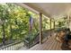 Relaxing front porch with rocking chairs, overlooking a wooded area at 123 Cherry St, Roswell, GA 30075