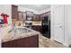 Well-equipped kitchen featuring dark cabinetry and granite countertops at 295 Sweetshrub Dr # 2, Austell, GA 30168