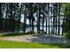 Lakeside picnic area with table under tall trees at 1160 Pin Oak Ct, Cumming, GA 30041