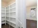 Walk-in pantry with white shelving and hardwood floors at 3394 Bryerstone Se Cir, Smyrna, GA 30080