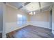 Formal dining room with hardwood floors, tray ceiling, and wainscoting at 4280 Hunters Walk Way, Cumming, GA 30028