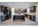 Modern kitchen with dark cabinetry, granite countertops, and island at 4280 Hunters Walk Way, Cumming, GA 30028