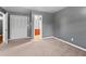 Spacious bedroom with gray walls, carpet, and en-suite bathroom access at 6418 Briarwood Ct, Riverdale, GA 30296