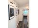 Bright hallway with dark hardwood floors and framed artwork at 1317 Liberty Nw Pkwy, Atlanta, GA 30318