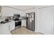 Bright kitchen with stainless steel appliances and white cabinets at 530 Brooksdale Dr, Woodstock, GA 30189