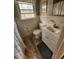 Clean bathroom with updated vanity and wood-look flooring at 2479 Landeau Cir, Tucker, GA 30084