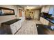 Bright eat-in kitchen with ample cabinet space and tile flooring at 2479 Landeau Cir, Tucker, GA 30084