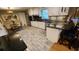 Updated kitchen featuring granite countertops, stainless steel appliances, and wood-look tile floors at 2479 Landeau Cir, Tucker, GA 30084