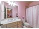 Well-appointed bathroom with a single vanity and shower/tub combo at 2996 Walking Horse Trl, Buford, GA 30519