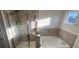 Bathroom with shower and tub at 602 Lofty Sw Ln, Atlanta, GA 30331