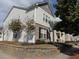 Two-story house with gray and white siding, stone accents, and landscaping at 602 Lofty Sw Ln, Atlanta, GA 30331