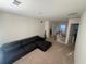 Loft area with a sectional sofa and neutral carpeting at 602 Lofty Sw Ln, Atlanta, GA 30331