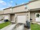 Rear view of townhome with attached garage at 7512 Rutgers Cir, Fairburn, GA 30213
