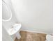 Clean powder room with pedestal sink and tile floor at 7512 Rutgers Cir, Fairburn, GA 30213