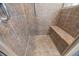 Large walk-in shower with tiled walls and seat at 2114 Summit Ct, Loganville, GA 30052