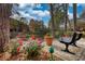 Serene waterfront seating area with flowers at 24317 Plantation Ne Dr # 317, Atlanta, GA 30324