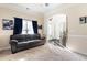 Cozy Gathering room featuring a comfortable sofa and neutral color scheme at 6280 Stillwood Ln, Cumming, GA 30041