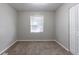 Simple bedroom with neutral walls and carpet at 2196 Swallow Se Cir, Atlanta, GA 30315