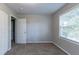Well-lit bedroom with neutral walls, carpet, and double closets at 2196 Swallow Se Cir, Atlanta, GA 30315