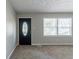 Bright living room with neutral walls, new carpet, and a window at 2196 Swallow Se Cir, Atlanta, GA 30315