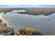 Aerial view showcasing waterfront property and surrounding landscape at 923 Pine Cir, Woodstock, GA 30189