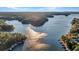 Aerial view of the lakefront property and beautiful scenery at 923 Pine Cir, Woodstock, GA 30189
