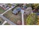 Stunning aerial view of a home with a large yard and driveway at 923 Pine Cir, Woodstock, GA 30189