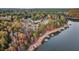 Aerial view of lakefront homes and sandy shoreline at 923 Pine Cir, Woodstock, GA 30189