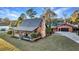 Charming log cabin home with a large backyard and detached garage at 923 Pine Cir, Woodstock, GA 30189