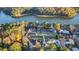 Aerial view showcasing lakefront property with multiple homes at 923 Pine Cir, Woodstock, GA 30189