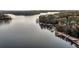 Aerial view of lakefront property with beautiful fall foliage and private docks at 923 Pine Cir, Woodstock, GA 30189