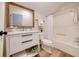 Clean bathroom with a white vanity, bathtub and vinyl flooring at 923 Pine Cir, Woodstock, GA 30189