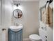 Charming bathroom with a pedestal sink and shiplap walls at 923 Pine Cir, Woodstock, GA 30189