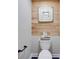 Small bathroom with wood-paneled feature wall at 923 Pine Cir, Woodstock, GA 30189