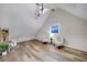 Bonus room with two chairs and a ceiling fan at 923 Pine Cir, Woodstock, GA 30189