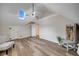 Large bonus room with skylight, wood flooring, and built-ins at 923 Pine Cir, Woodstock, GA 30189