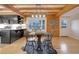 Dining area with hardwood floors and a rustic wooden table at 923 Pine Cir, Woodstock, GA 30189