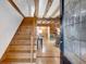 Inviting entryway with wooden staircase and exposed beams at 923 Pine Cir, Woodstock, GA 30189