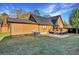 Log cabin home with a large backyard and detached garage at 923 Pine Cir, Woodstock, GA 30189