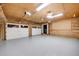 Spacious three-car garage with ample storage and epoxy floor at 923 Pine Cir, Woodstock, GA 30189