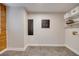 Laundry room with shelving and wood accent wall at 923 Pine Cir, Woodstock, GA 30189