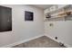 Bright laundry room with shelving and built-in storage at 923 Pine Cir, Woodstock, GA 30189