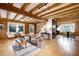 Spacious living room with exposed wooden beams and hardwood floors at 923 Pine Cir, Woodstock, GA 30189