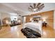 Spacious main bedroom with wood-paneled feature wall and hardwood floors at 923 Pine Cir, Woodstock, GA 30189