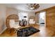 Main bedroom sitting area with wicker chairs and hardwood floors at 923 Pine Cir, Woodstock, GA 30189