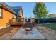 Cozy backyard patio with fire pit, ideal for outdoor gatherings at 923 Pine Cir, Woodstock, GA 30189