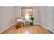 Bright sitting room with hardwood floors and a comfortable chair at 923 Pine Cir, Woodstock, GA 30189