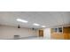 Large workshop area with high ceilings and multiple overhead lights at 923 Pine Cir, Woodstock, GA 30189
